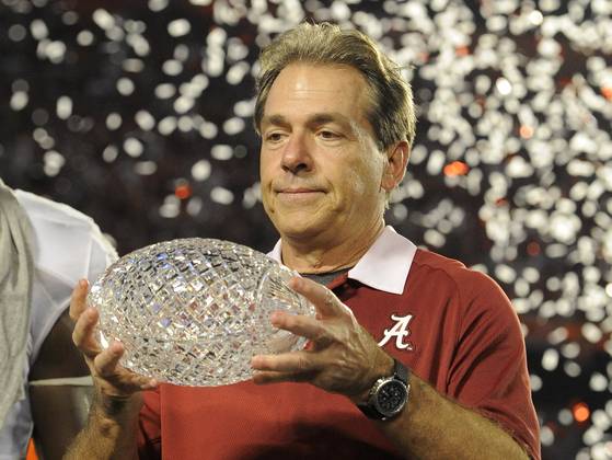 Alabama head coach Nick Saban with the old National Championship trophy.