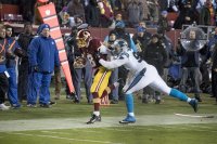 Kawann Short pushes Kirk Cousins out of bounds.