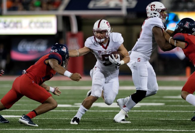 NFL Rookie Odds: O/Us for the Best Non-QBs McCaffrey delivering a stiff-arm