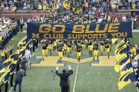 Michigan players running onto field