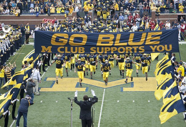 Michigan players running onto field