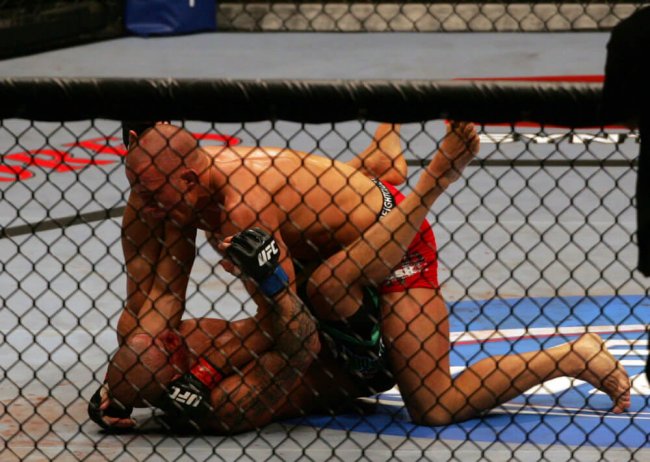 11 July 2009: Georges St-Pierre of Canada on top and Thiago Alves of Brazil exchange punches during their welterweight fight at the UFC 100 event at the Mandalay Bay Events Center in Las Vegas, NV. St-Pierre wins by unanimous decision over Alves in the fifth round.