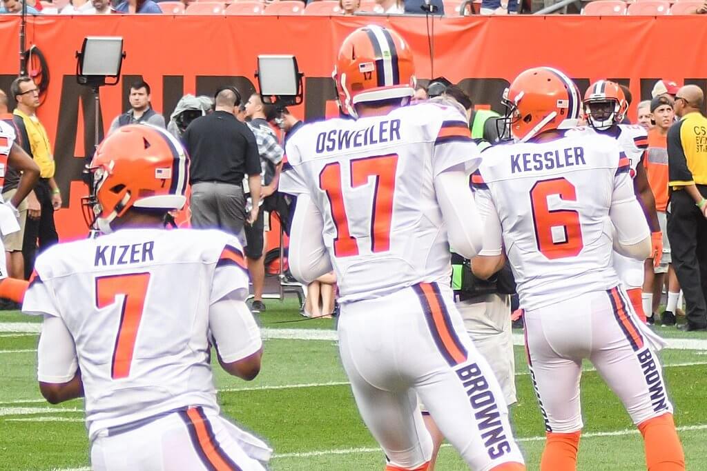 Three Browns QBs warming up.