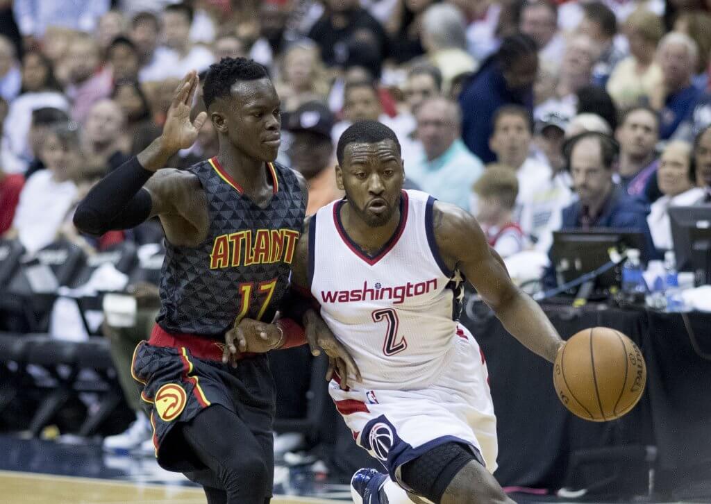 Dennis Schroder defends John Wall