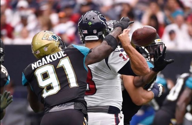 Yannick Ngakoue of the Jacksonville Jaguars making a strip-sack