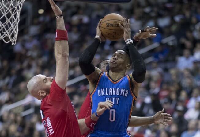 Russell Westbrook goes hard to the hole against the Washington Wizards.