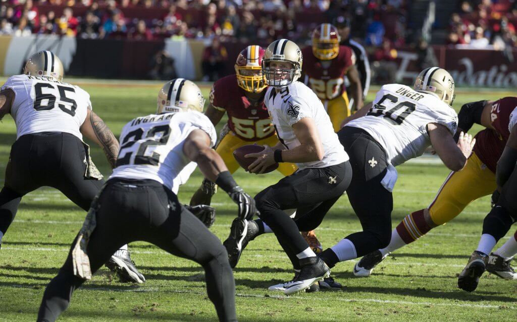 Drew Brees handing the ball off