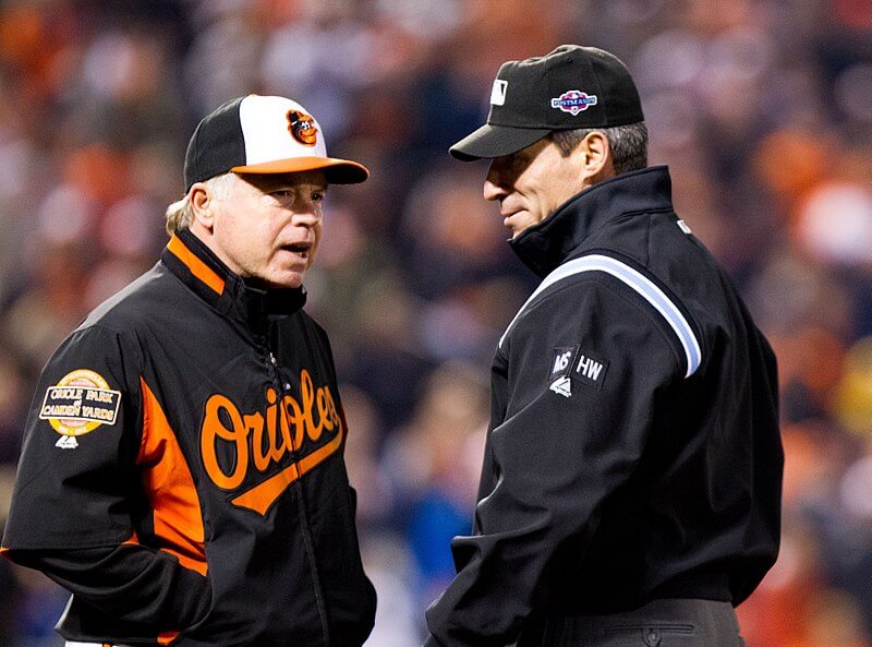 Orioles manager Buck Showalter talking to an umpire
