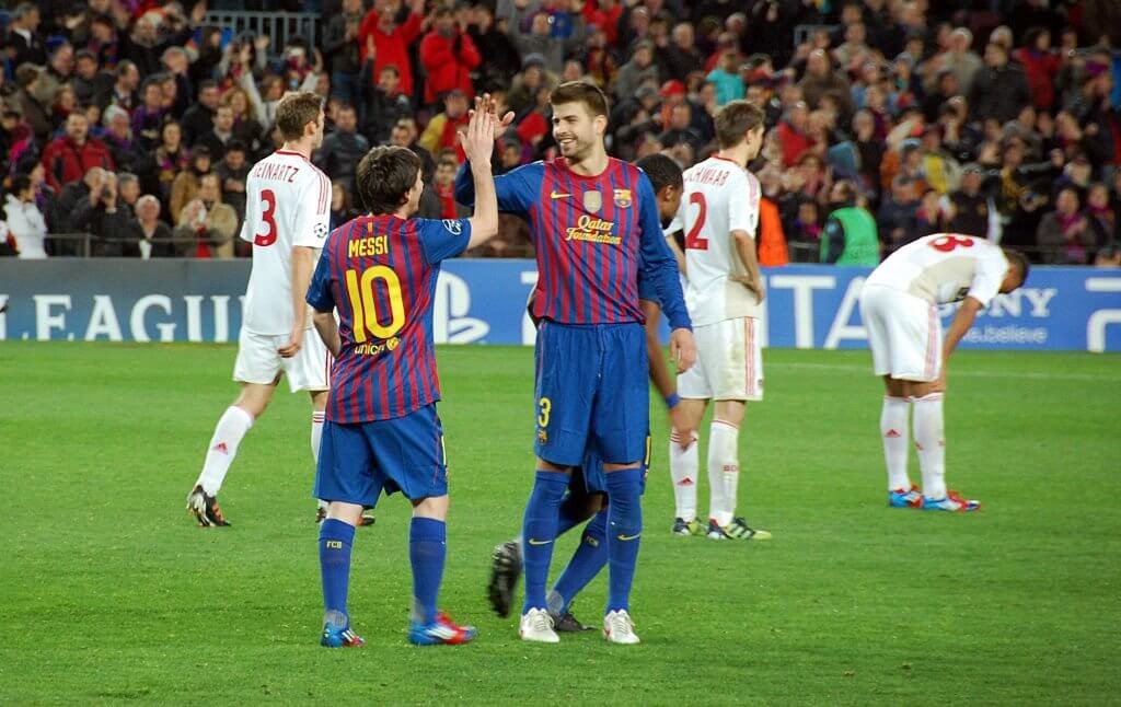 Messi and Pique celebrate.