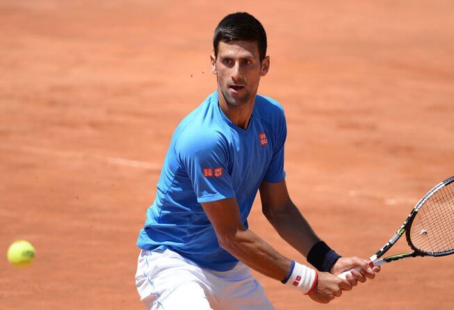 Novak Djokovic playing on clay court