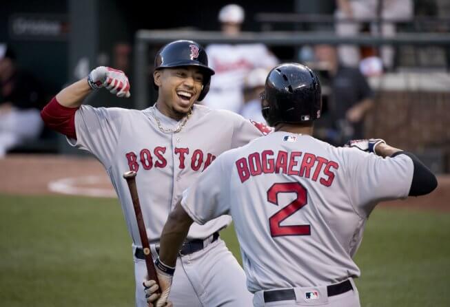 Mookie Betts celebrates at home plate.