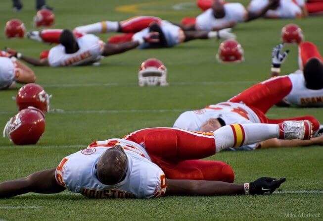 Chiefs players stretching pre-game.