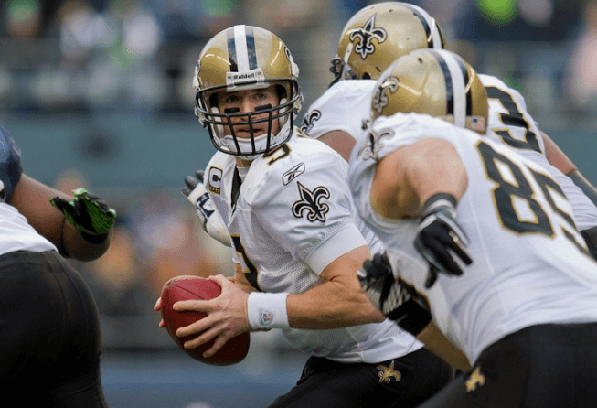 NFL Week 2 Predictions & Best Bets: Saints Bounce Back, Chiefs/Steelers Go OVER Saints QB Drew Brees handing the ball off.