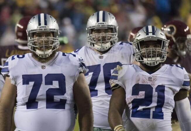 Cowboys offensive linemen Travis Frederick and Richard Ash with RB Ezekiel Elliott.