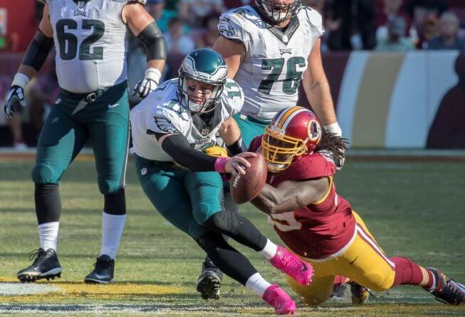 Eagles QB Carson Wentz getting tackled.