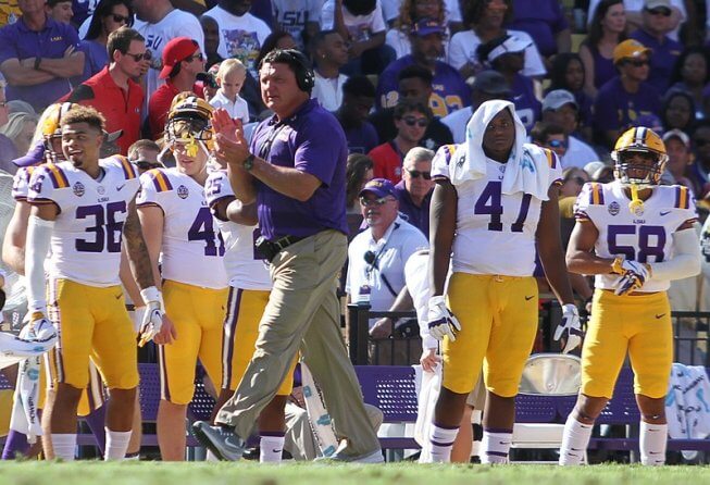 LSU coach Ed Orgeron clapping on the sidelines.