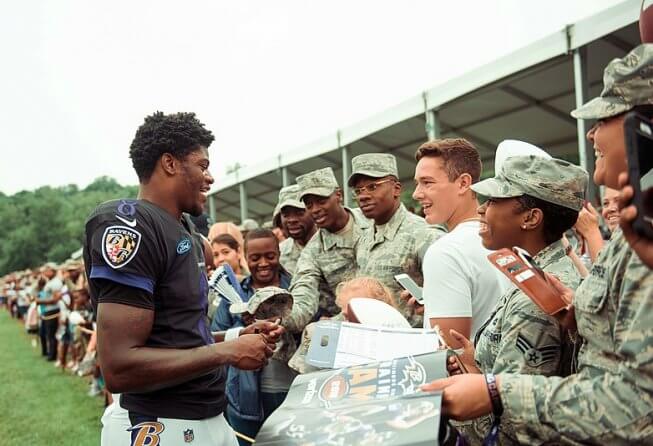 Lamar Jackson signing autographs