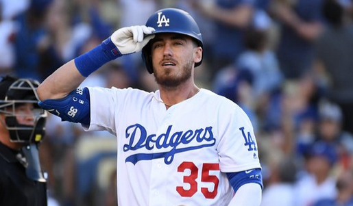 Cody Bellinger tossing a ball