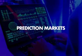 Laptop screen displaying financial data and charts with “Prediction Markets” text overlay, representing online event trading platforms_