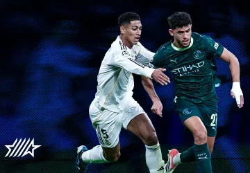 Acción de juego entre 2 jugadores del real madrid y el manchester city en la champions league